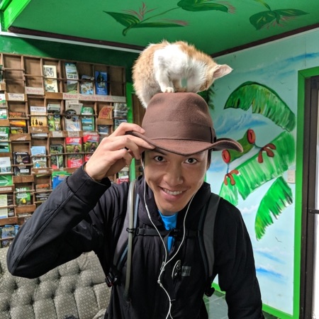 Photo of me, wearing a hat with a cat on it